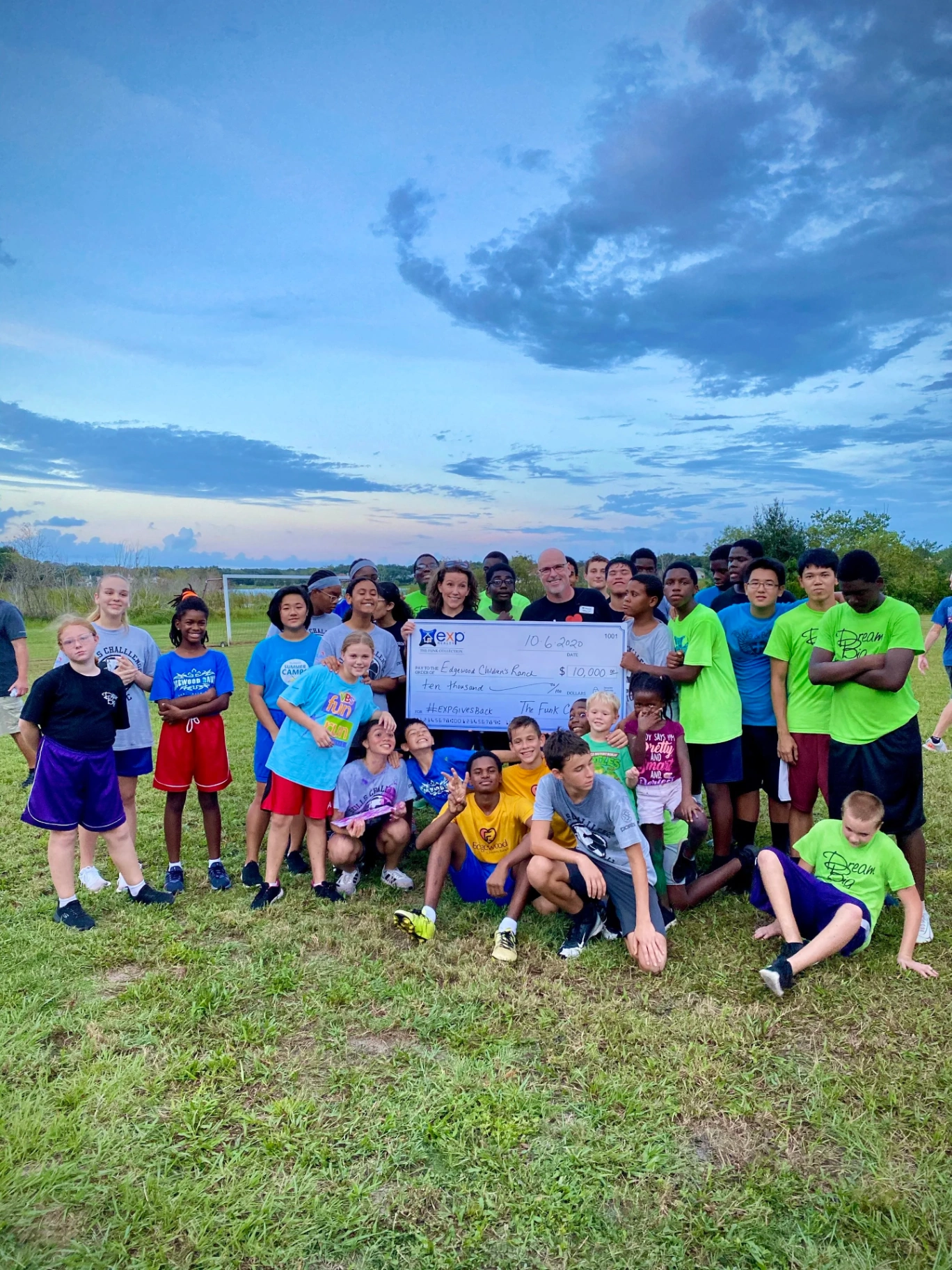 The Funks presenting a $10,000 eXp Gives Back check to Edgewood Children's Ranch