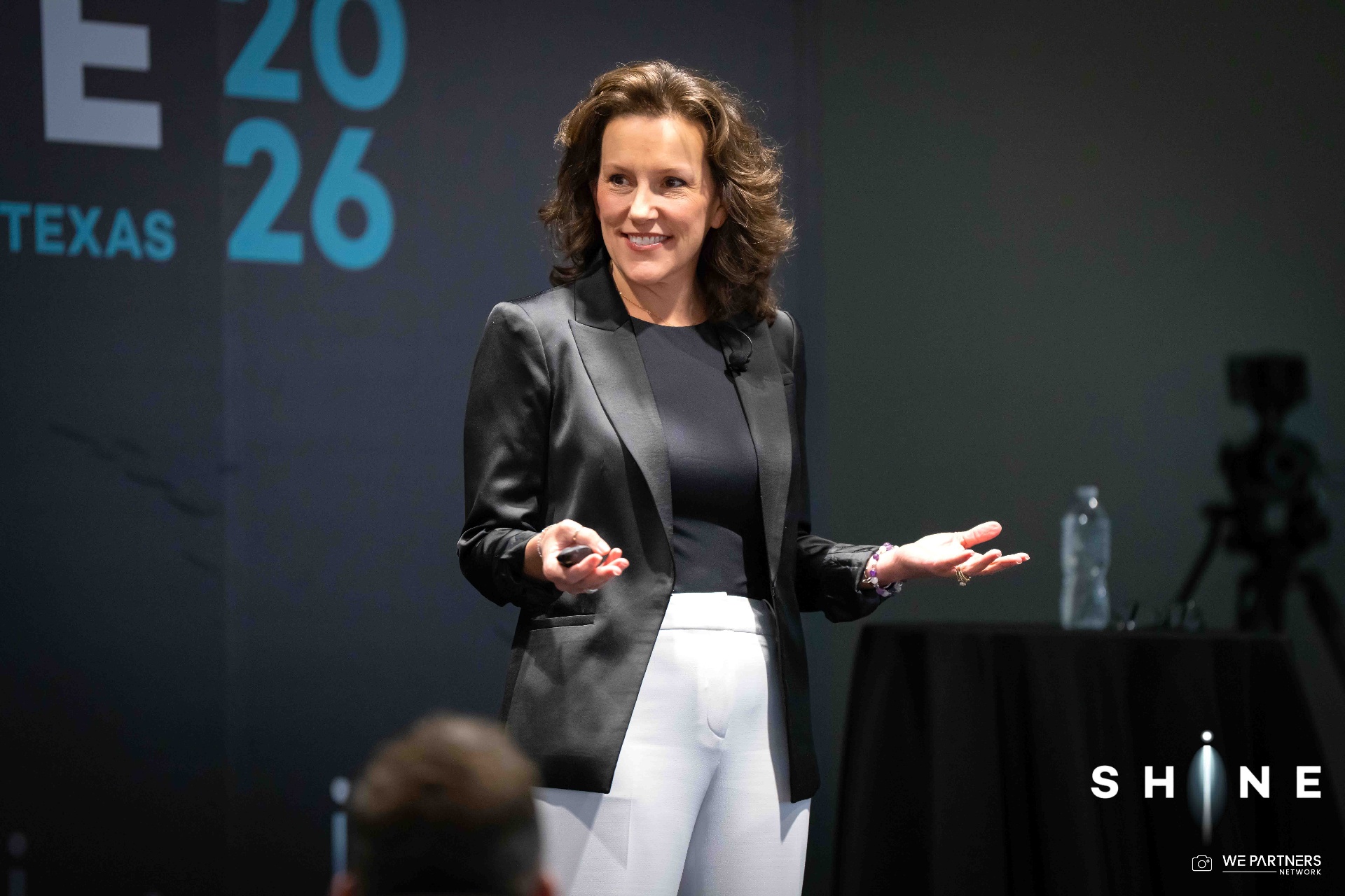 Renee Funk speaking on stage
