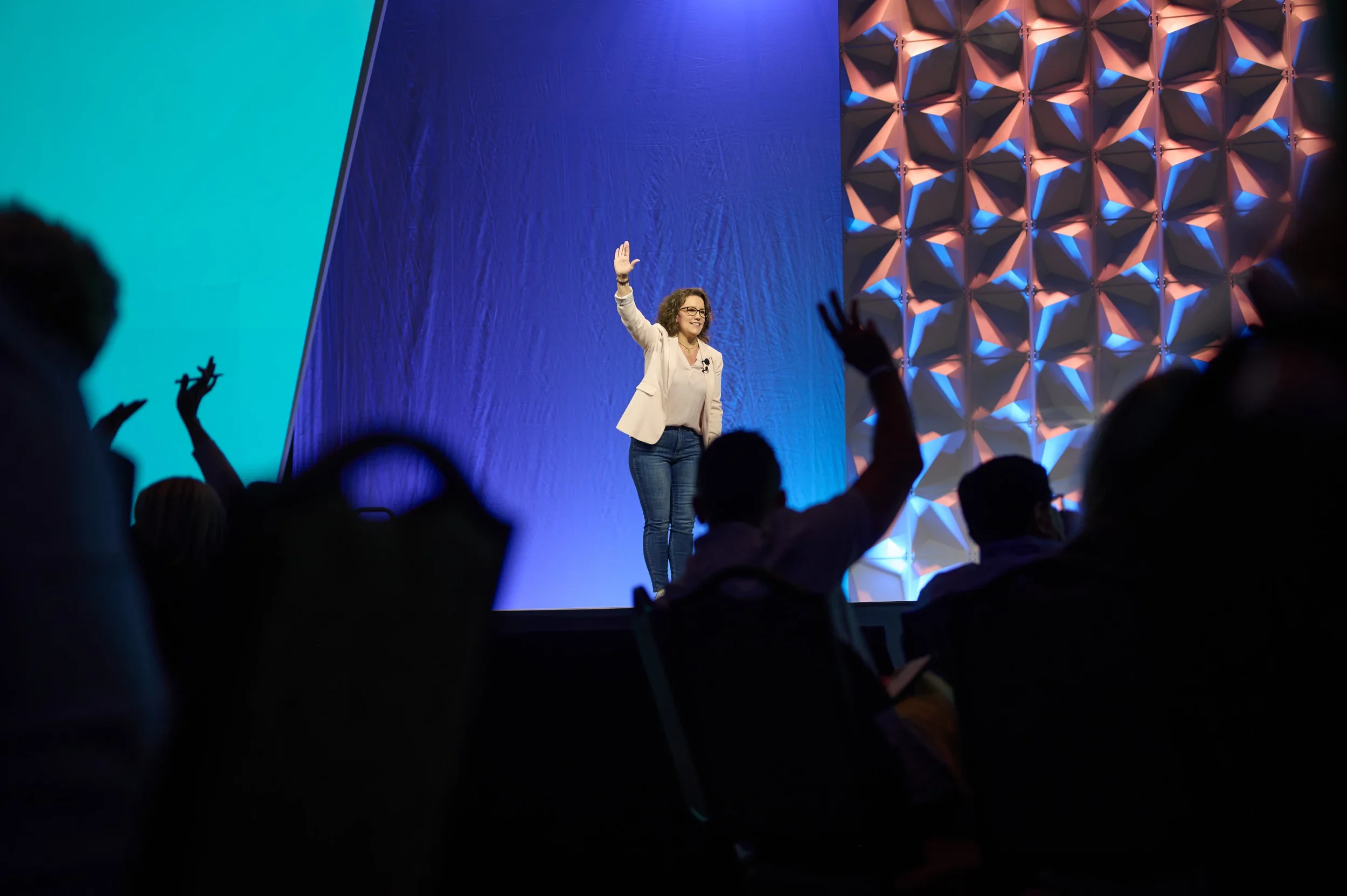 Renee Funk on stage speaking to the audience