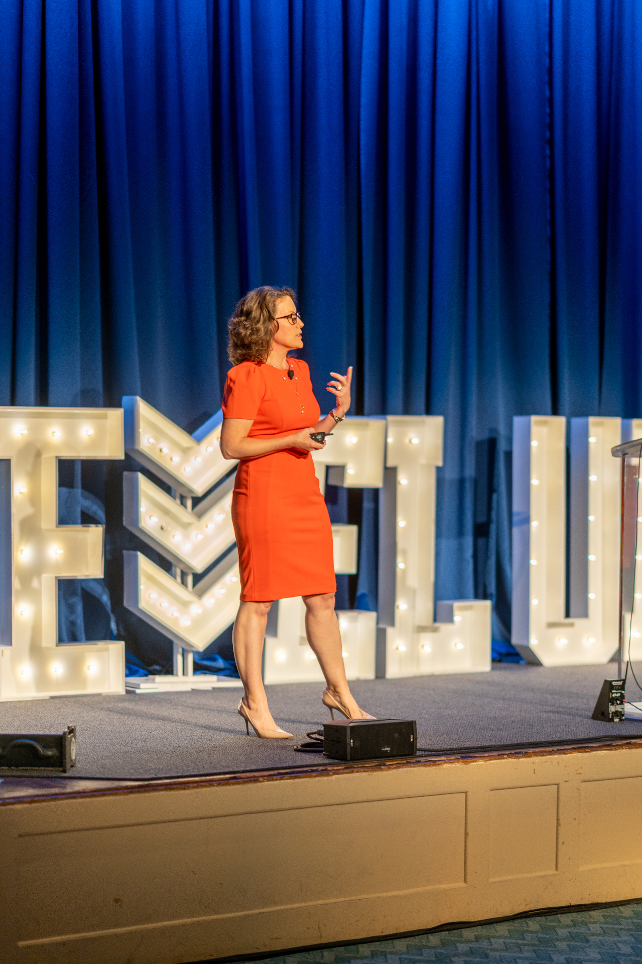 Renee Funk speaking on stage